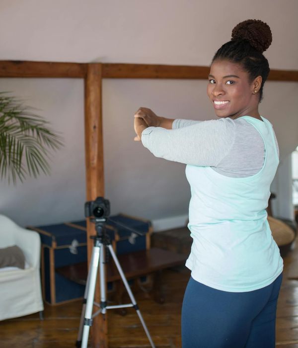Woman feeling energetic and happy during her home workout.